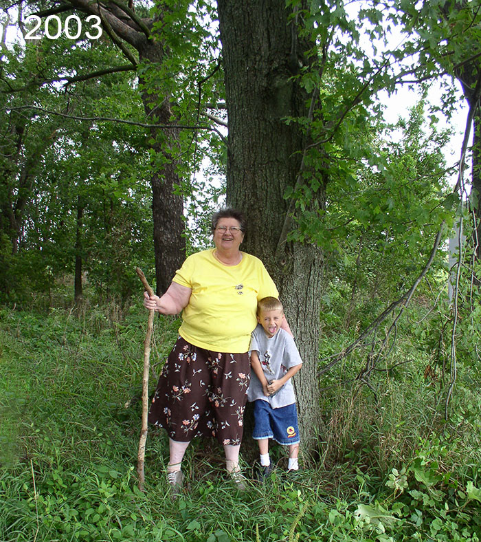 Mom with grandson in front of maple tre she and her dad planted 70 years ago when she was 6 years old.